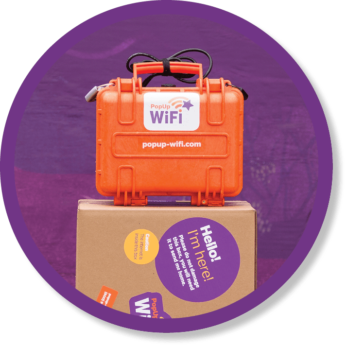 Image of PopUp WiFi's Go HD unit sitting on a packing box